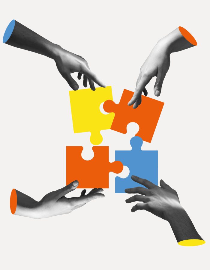 Concept of team work: graphic of hands putting together jigsaw puzzle