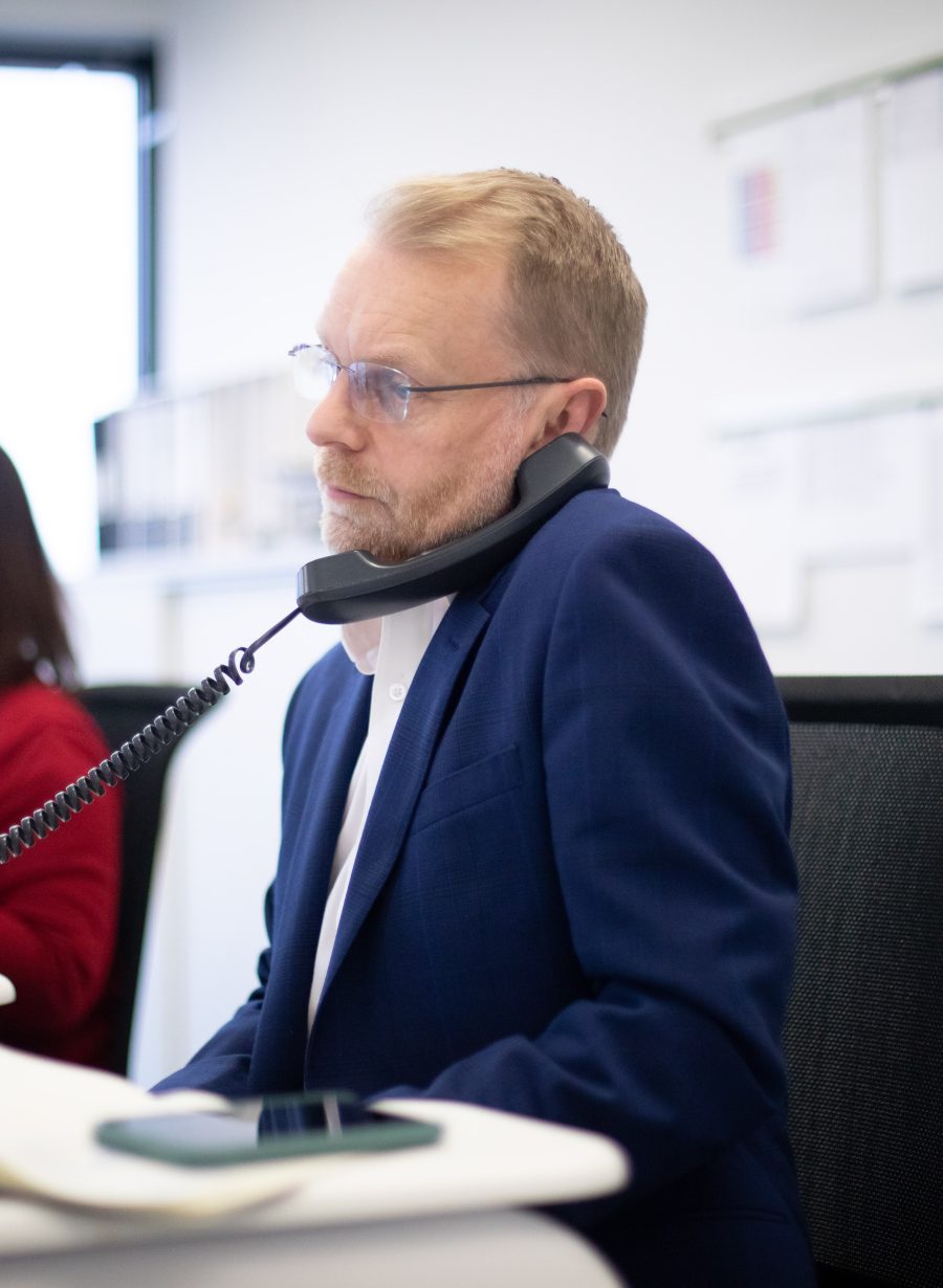 John Innes on the phone in the Think office